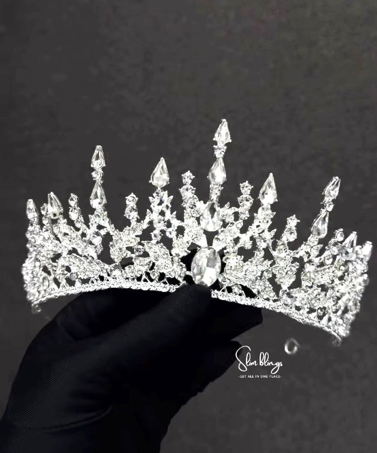The classic silver-tone setting seamlessly complements a wide range of bridal hairstyles, from intricate updos to flowing, romantic waves.
