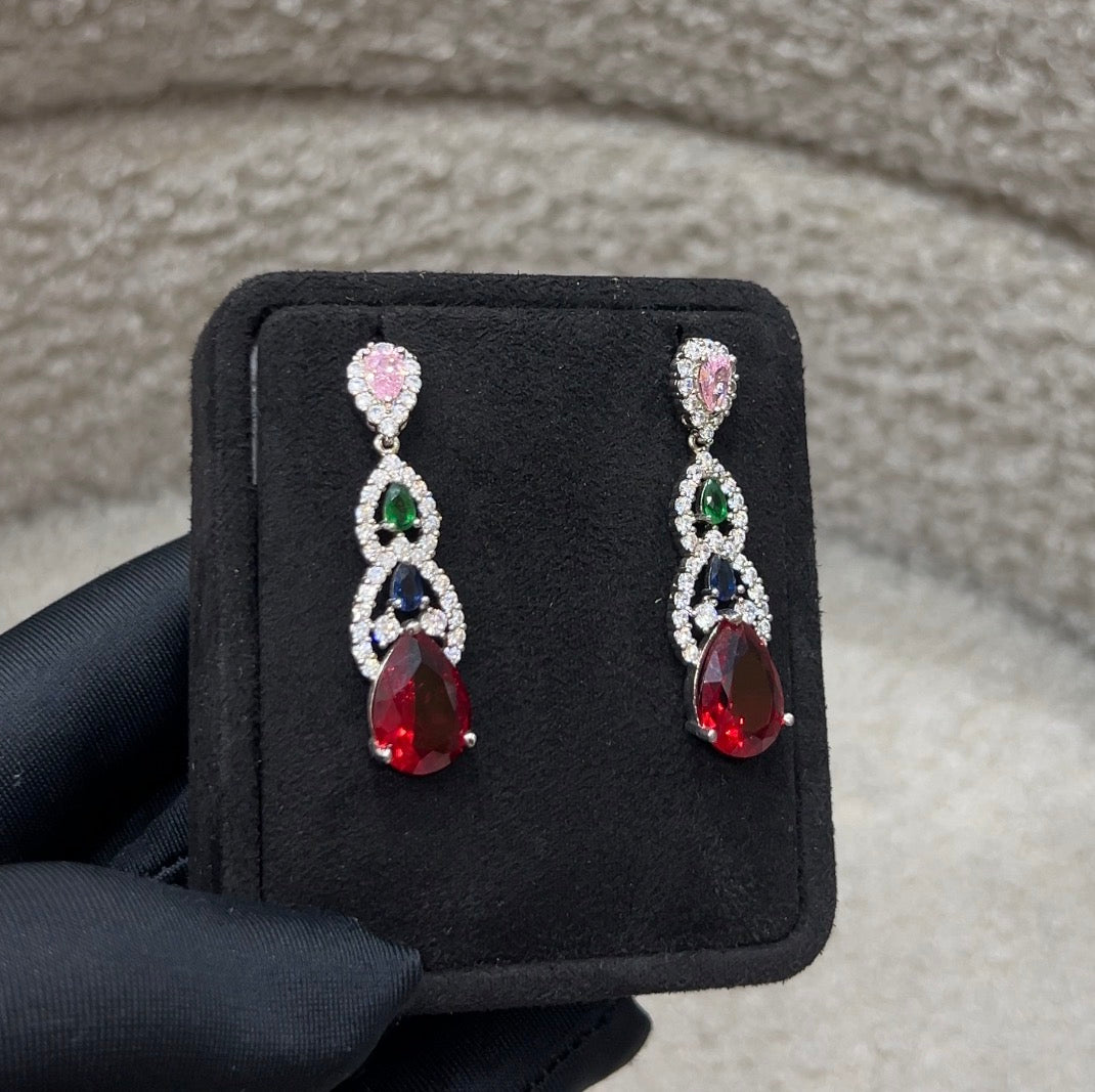 A stunning combination of ruby-red, sapphire-blue, emerald-green, and blush-pink crystals.