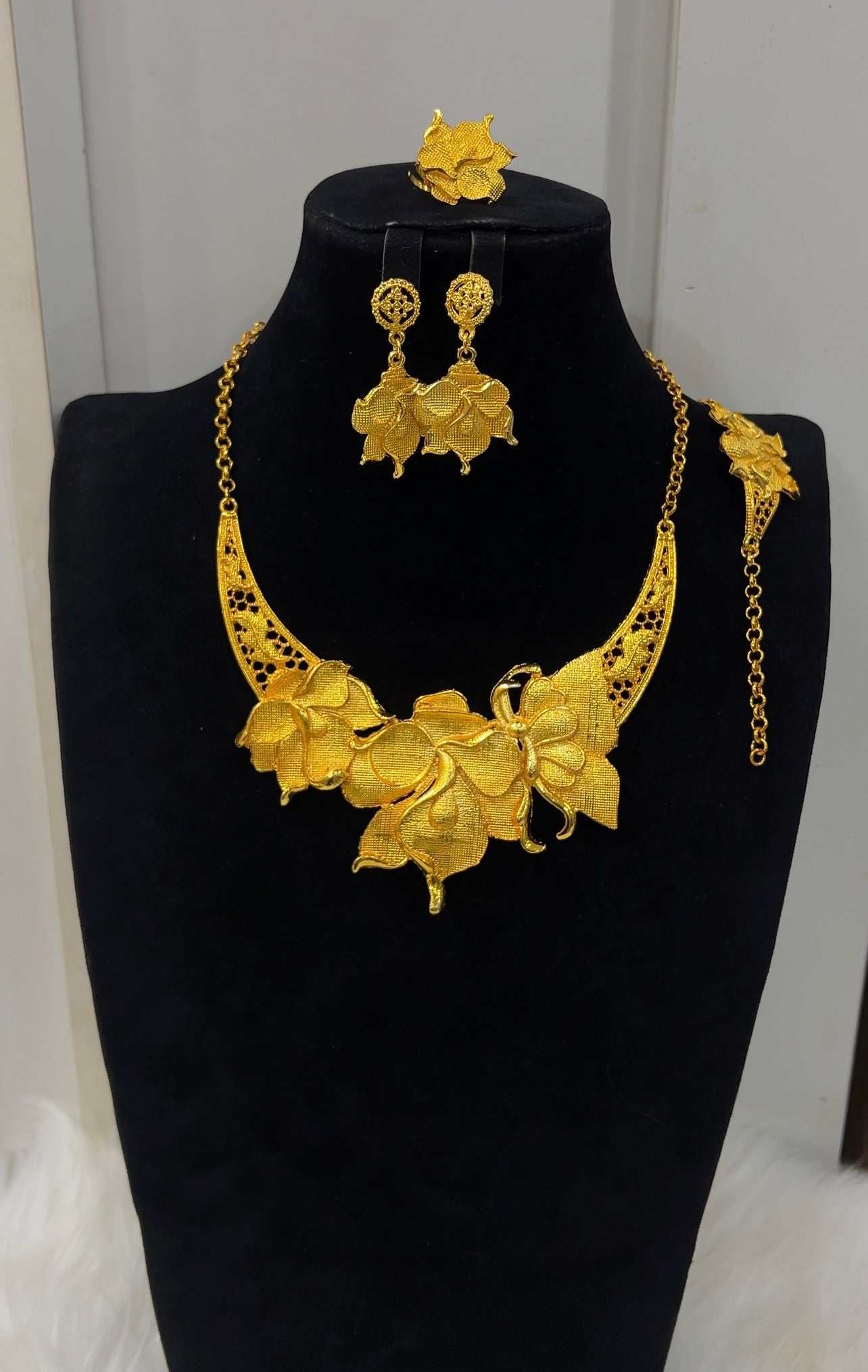Complete with matching orchid drop earrings, an adjustable link bracelet, and a matching statement ring, this bridal or evening set exudes dramatic elegance and haute couture flair.