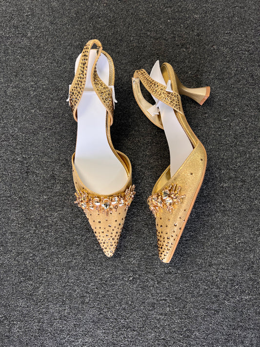 Complete with an elegant flared kitten heel and an adjustable, rhinestone-dusted slingback strap, they offer the perfect balance of show-stopping style and wearable comfort.