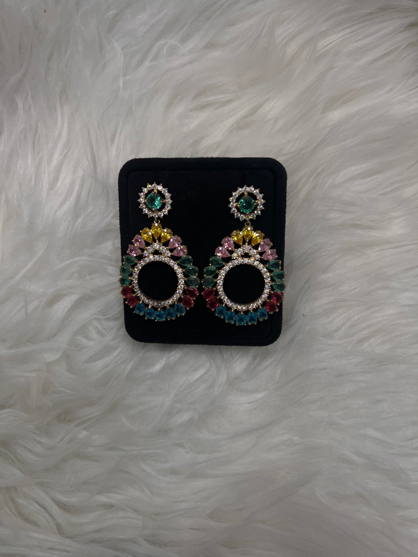 Crowned with a matching halo stud post, these earrings deliver an ultra-luxurious, playful, and glamorous touch to any neutral gown or bold party look.