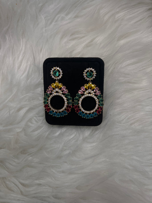 Crowned with a matching halo stud post, these earrings deliver an ultra-luxurious, playful, and glamorous touch to any neutral gown or bold party look.