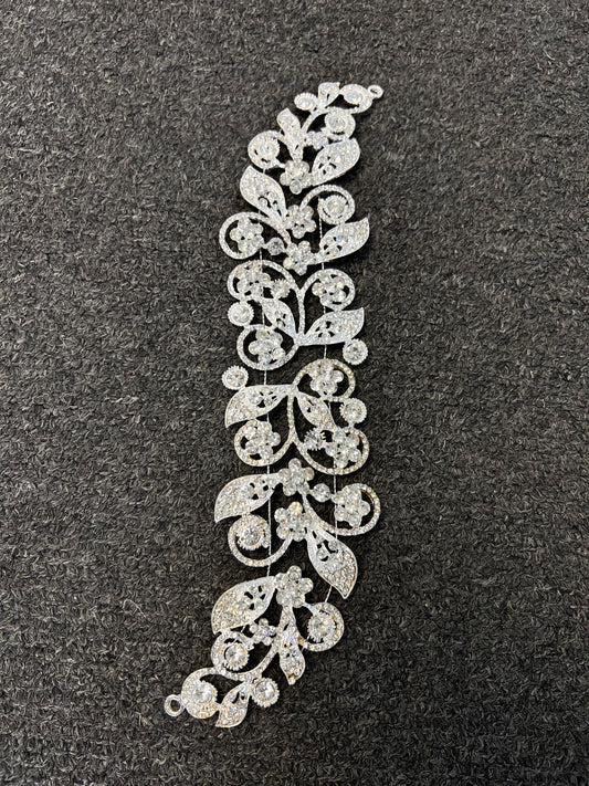A silver-toned filigree vine and leaf decorative trim piece with intricate openwork detailing. Ideal for bridal wear, bridesmaids, galas, and formal evening events
