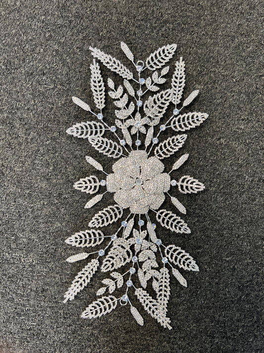 A white embroidered lace applique featuring a central floral motif surrounded by symmetrical leaf and vine patterns,deal for brides, statement bridal updos, galas, pageants, and formal evening events