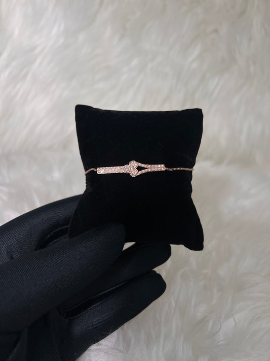 A delicate rose gold bracelet with a pavé-set center. The sliding box-chain closure ensures a snug, comfortable fit without traditional clasps.