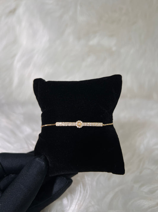 The adjustable pull closure allows you to easily tailor the fit for any wrist size, making it an ideal choice for bridal parties, special occasion wear, or stacking with your favorite gold timepieces.