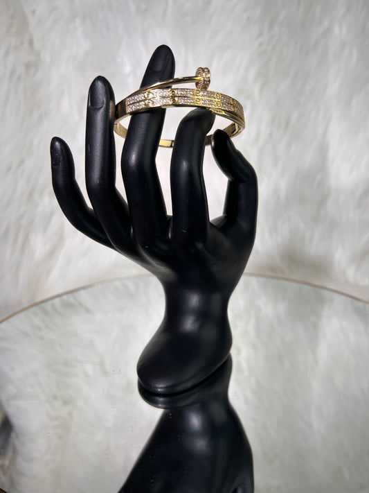 Serves as a standalone high-fashion piece or pairs seamlessly with classic designer bangles for a stacked luxury look.