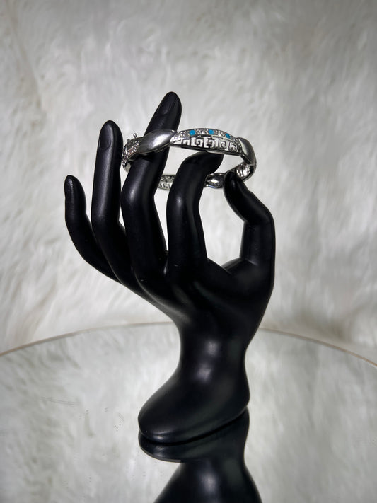Ideal for introducing texture and color to chic resort wear, boho-inspired maxi dresses, or tailored blazers. It functions beautifully as a standalone focal piece or paired with silver arm cuffs.