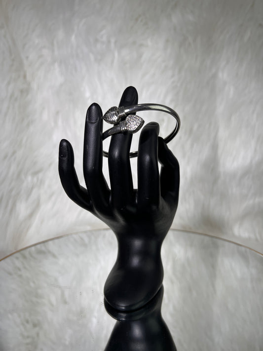 Perfect for bridging the gap between daytime chic and evening glam. Wear it solo for a clean, sculptural statement, or stack it alongside fine chain bracelets and watch cuffs for a layered look