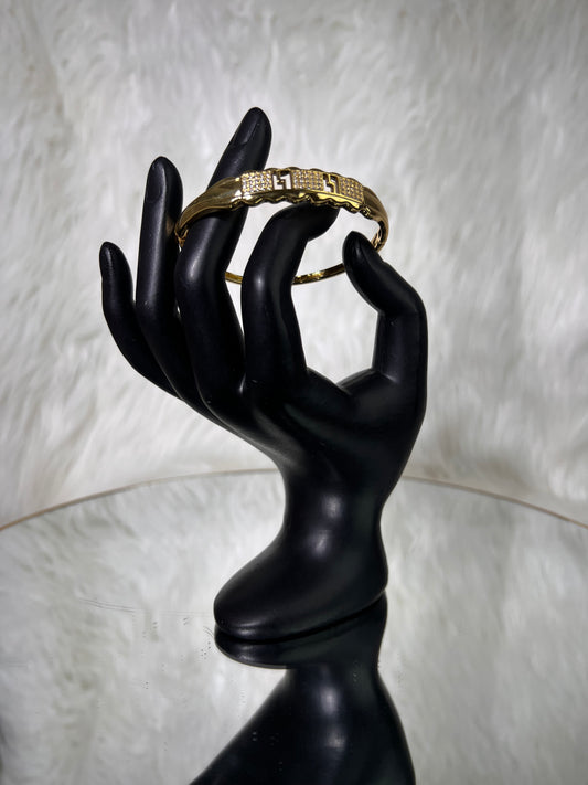 Crafted with a contoured, comfortable silhouette, it offers a secure fit perfect for stacking or making a solo statement.