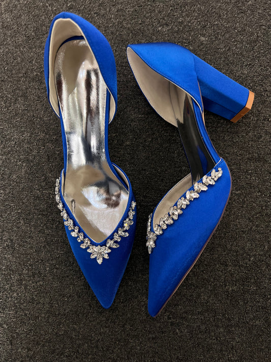 A pair of royal blue pointed-toe high heels with crystal embellishments on the toe area,

Ideal For: Evening wear, gala events, formal receptions, and statement styling