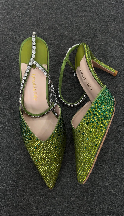 The entire toe box and side panels are blanketed in a crystals that transition from a bright,  capturing light with every movement.