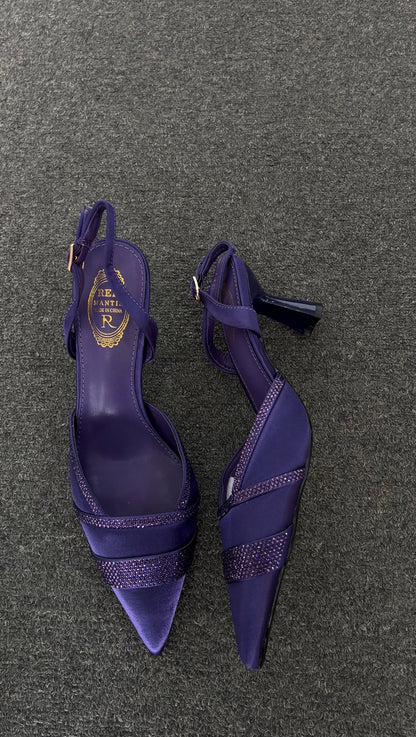 The unique flared heel provides a modern twist on the classic slingback, making them as comfortable as they are gorgeous
