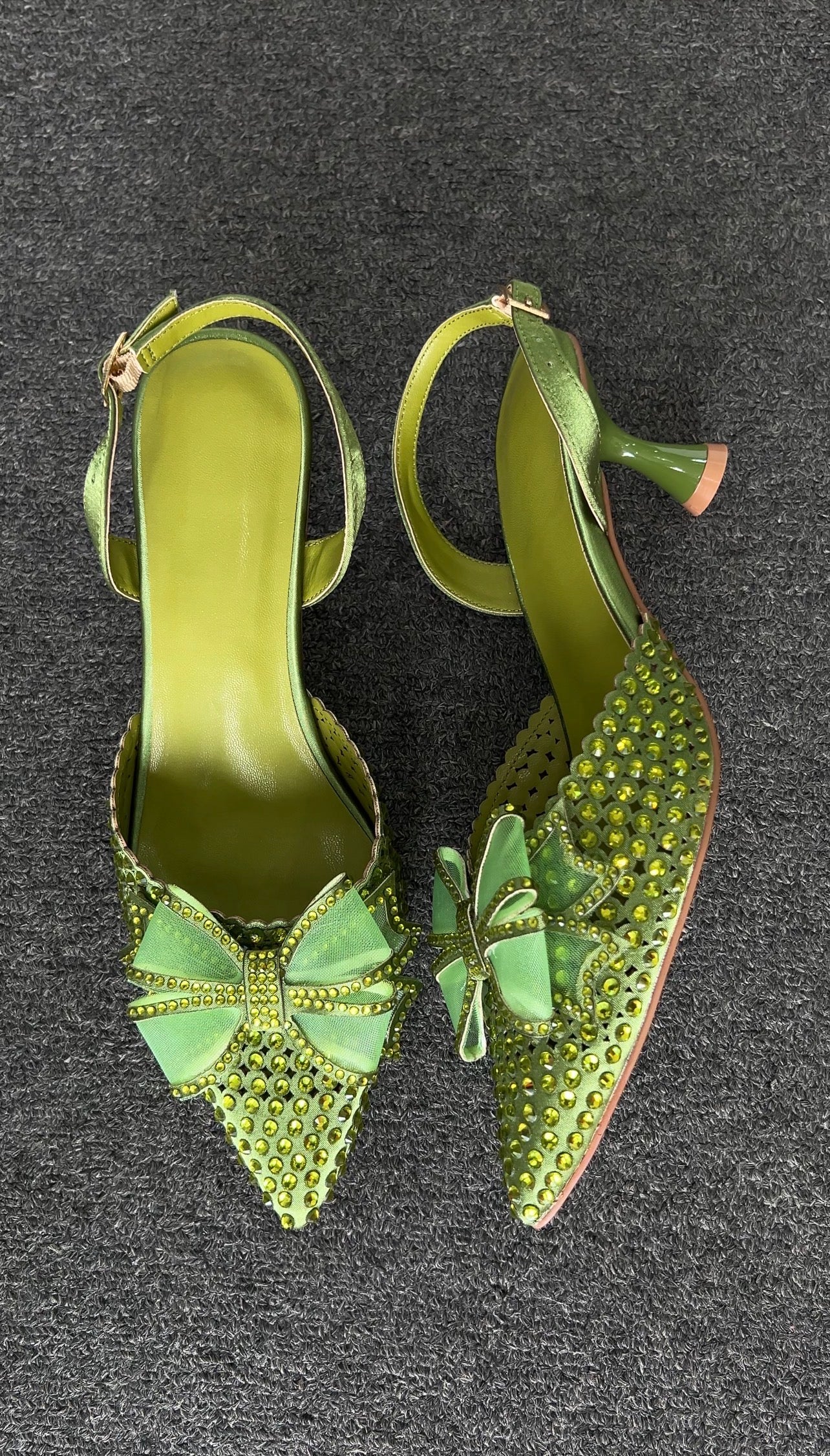 Green high-heeled shoes with butterfly, A perfect statement piece for garden weddings or high-fashion spring events.