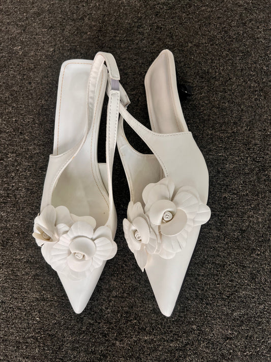 These heels are a fantastic choice for brides looking for a chic reception shoe, bridesmaids, or professionals attending a garden party.