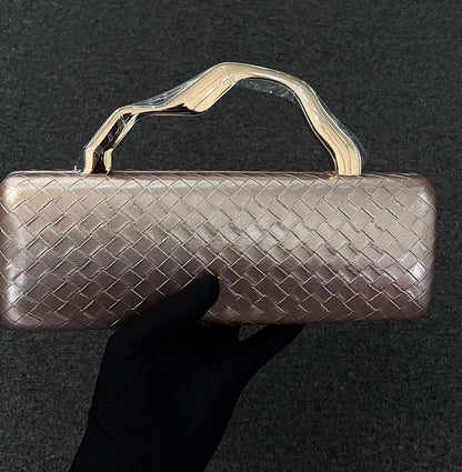 this structured clutch is designed to be the centerpiece of your look. Bold, artistic, and entirely unforgettable.