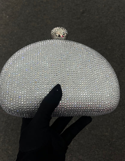 Featuring a round crystal-studded clasp, this piece is designed to be the centerpiece of your formal evening wear, catching the light with every movement.
