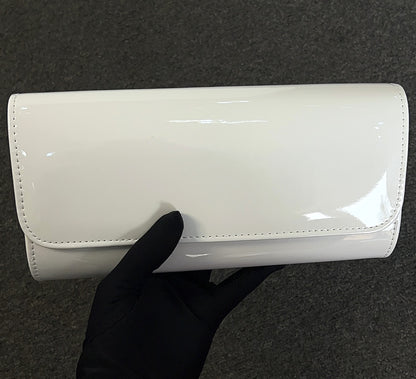 The patent material is durable and easy to wipe clean, keeping your accessory looking fresh event after event.