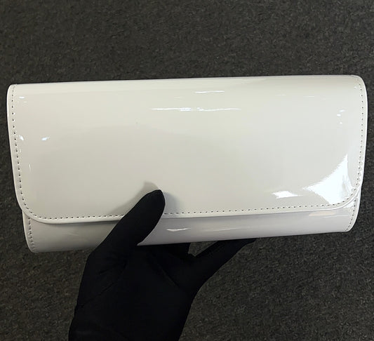 The patent material is durable and easy to wipe clean, keeping your accessory looking fresh event after event.