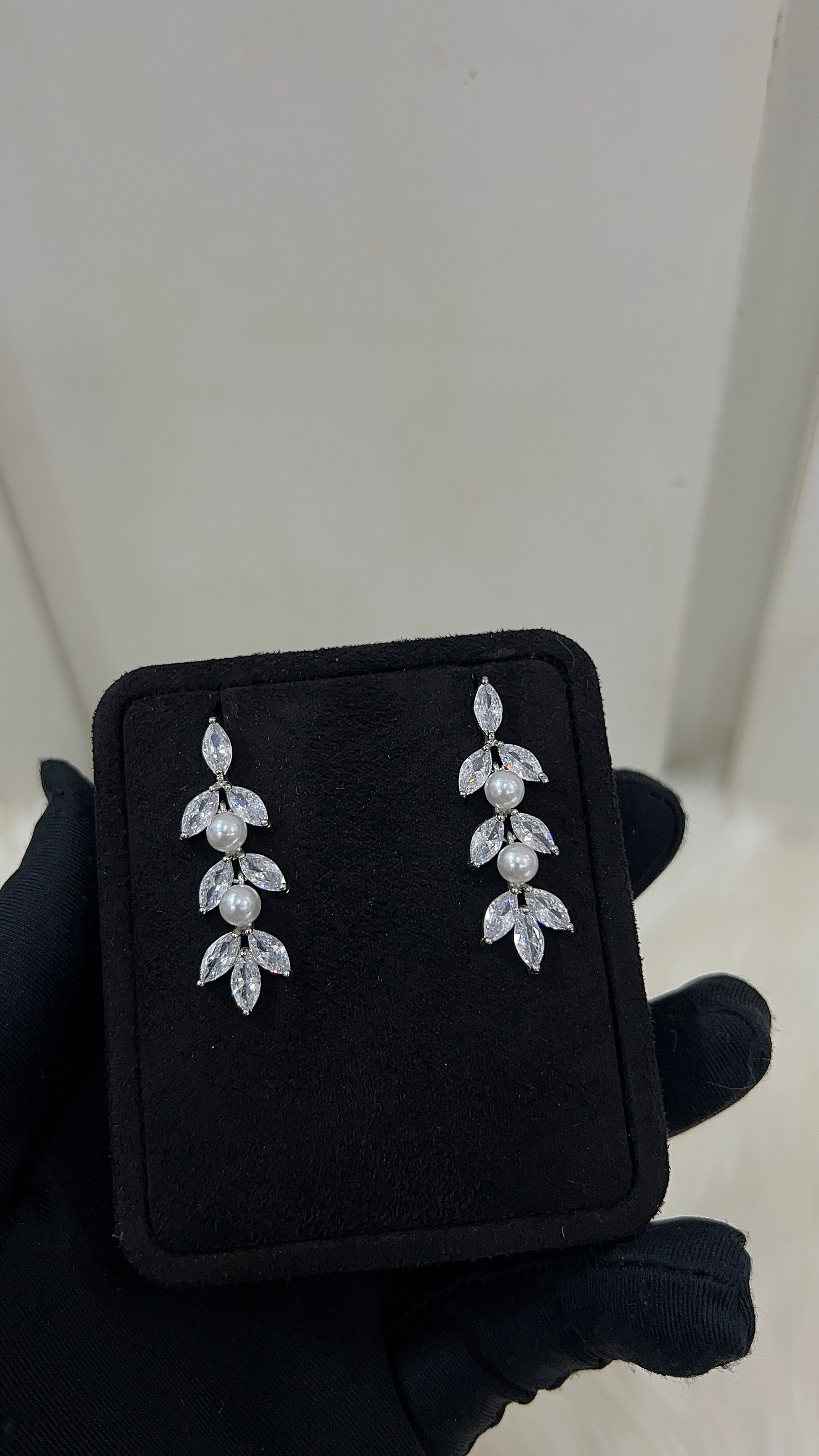 Pearl and crystal earrings . Features premium, high-clarity marquise cubic zirconia paired with lustrous pearls for a rich, textured shine.
