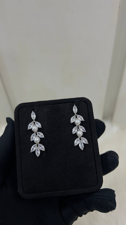 Pearl and crystal earrings . Features premium, high-clarity marquise cubic zirconia paired with lustrous pearls for a rich, textured shine.
