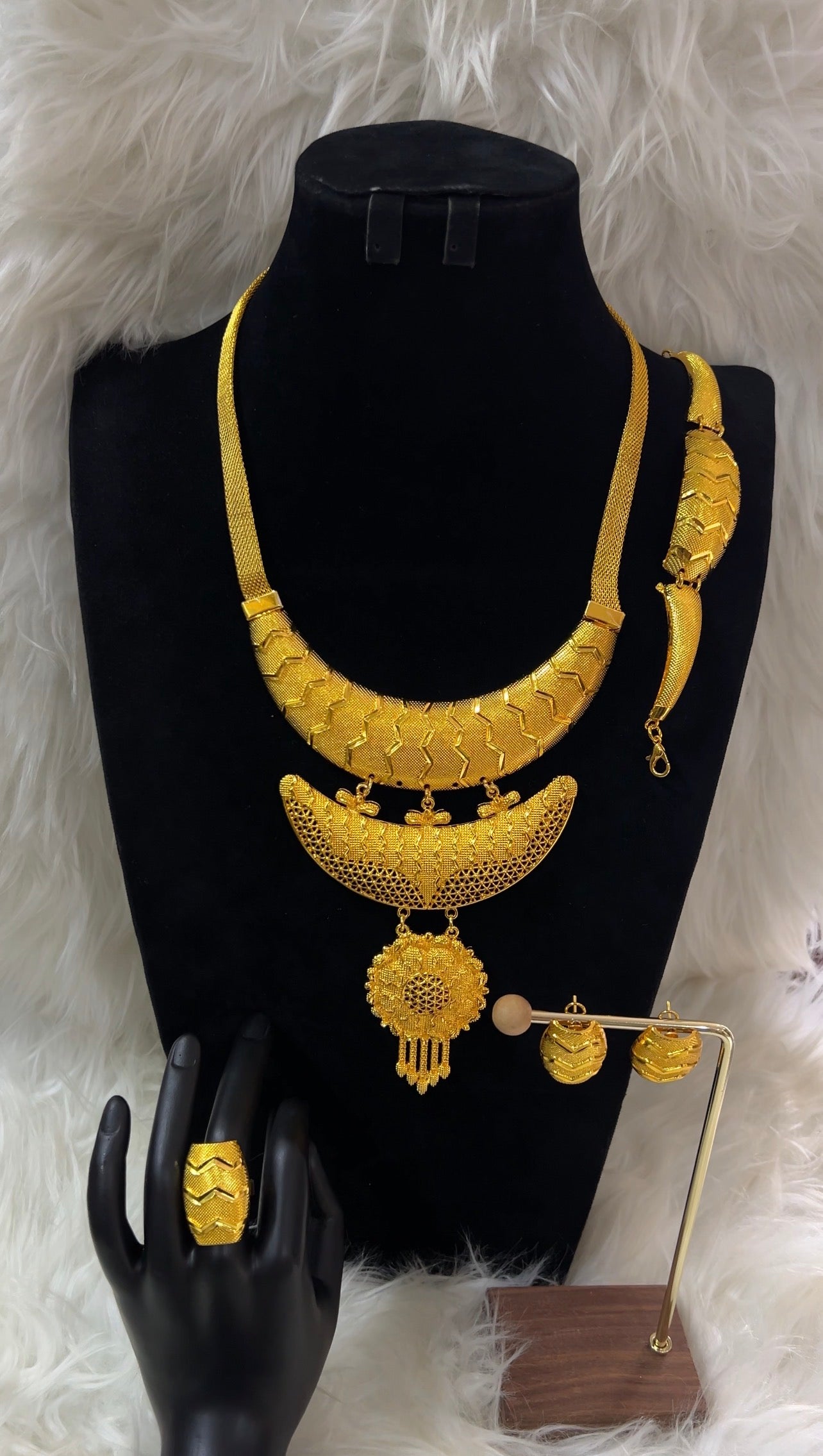 Gold necklace, earrings, and ring set , matching hoop-style studs, this uniform set guarantees a cohesive, high-impact sparkle for your most unforgettable milestones.