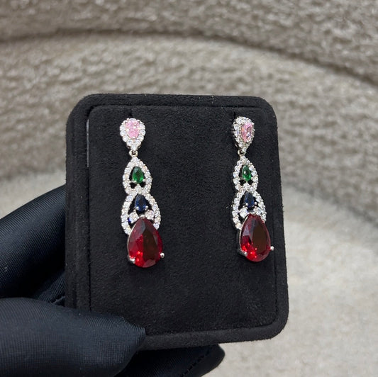  A stunning combination of ruby-red, sapphire-blue, emerald-green, and blush-pink crystals.
