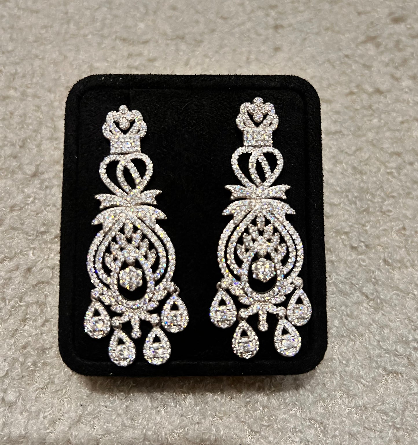 Pair of silver chandelier earrings. An exceptional choice for brides, pageants, or formal galas.