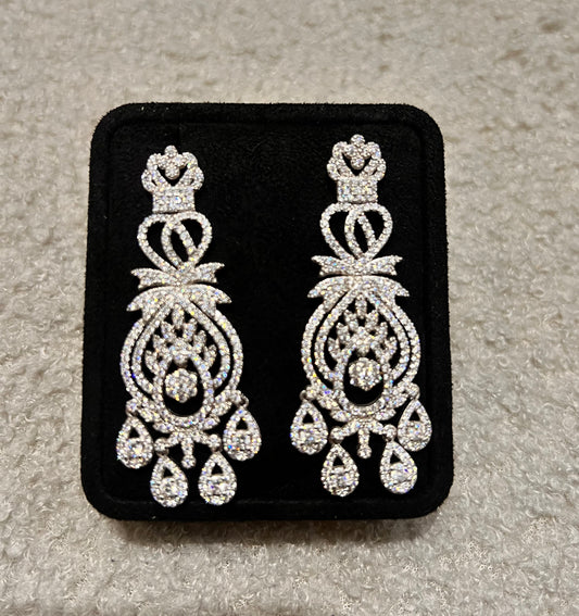 Pair of silver chandelier earrings. An exceptional choice for brides, pageants, or formal galas.