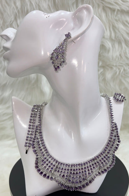 A bold, multi-layered collar design that elegantly frames the neckline, securing with a durable and seamless clasp.