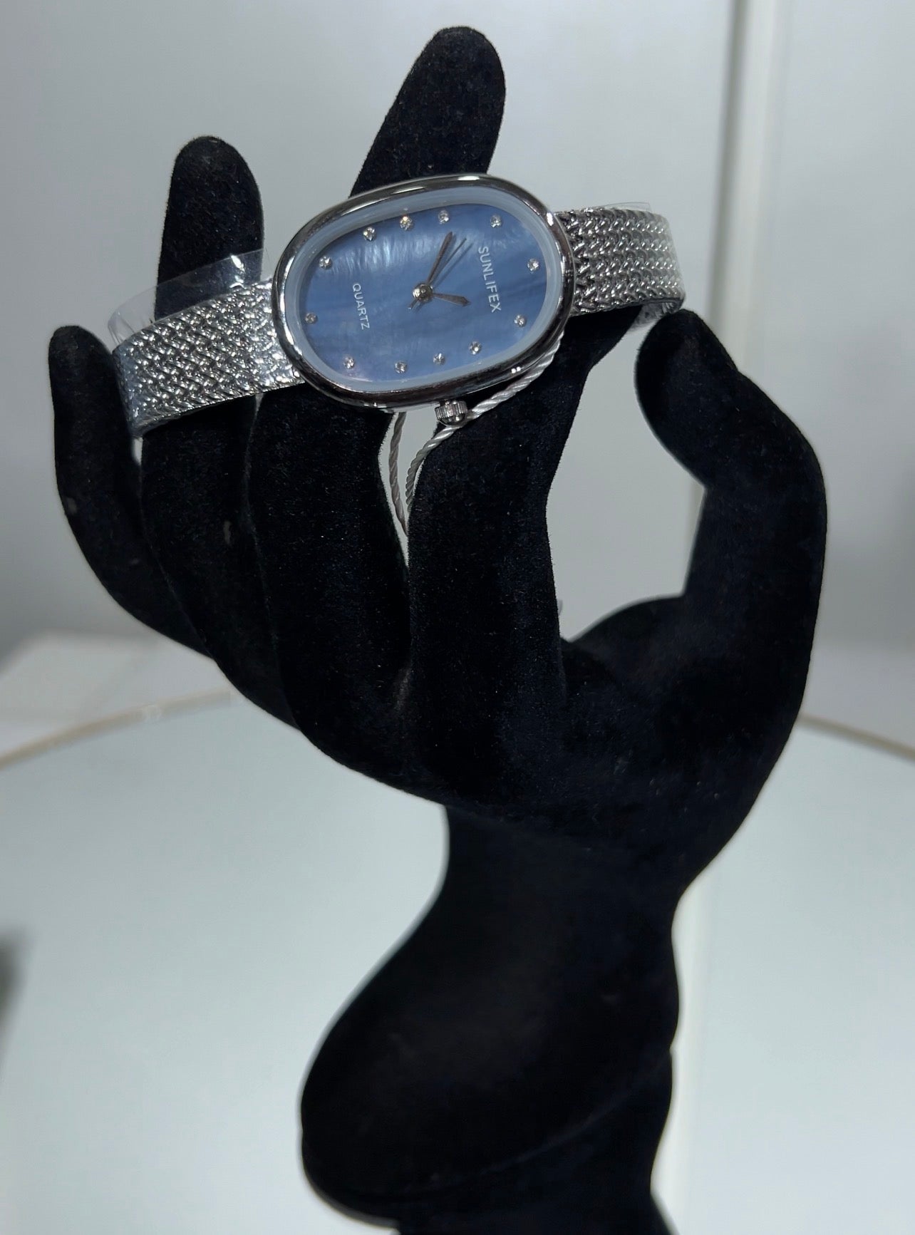 Each dial is accented with minimalist crystal markers, providing just the right amount of sparkle for both daytime office wear and evening events