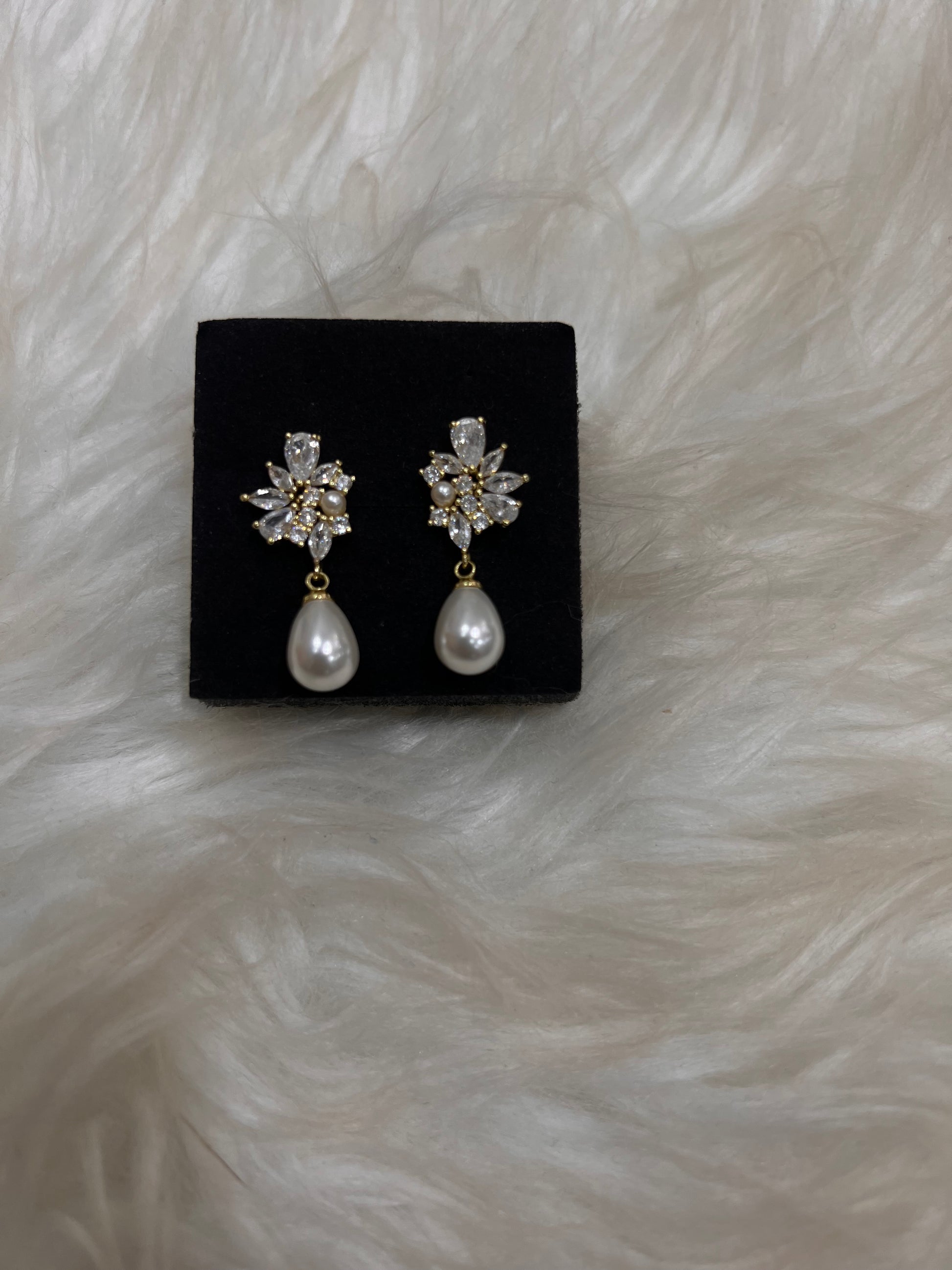 Pair of earrings, these earrings frame the face beautifully, pairing effortlessly with classic lace or modern satin bridal gowns.