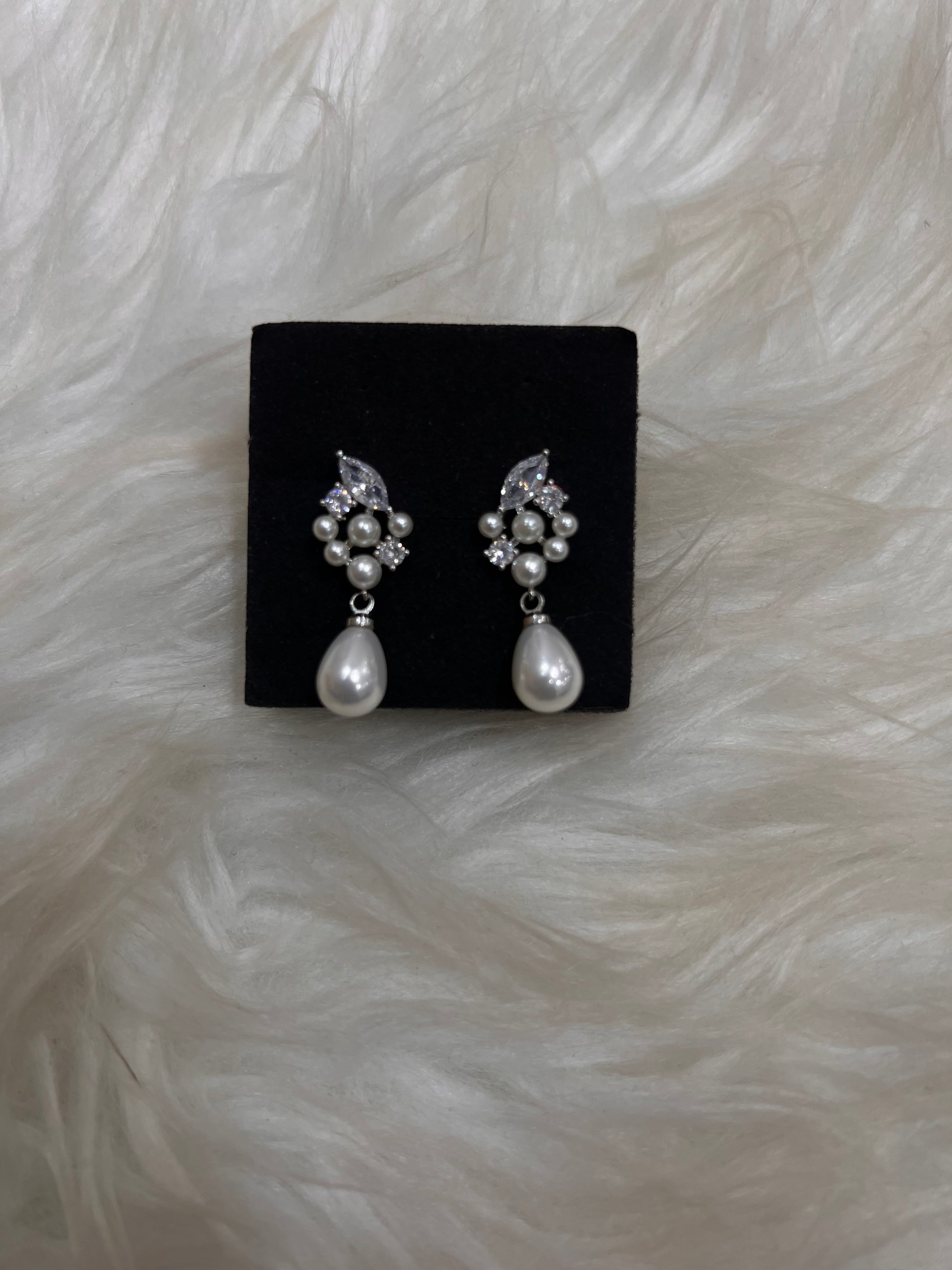  these earrings frame the face beautifully, pairing effortlessly with classic lace or modern satin bridal gowns.