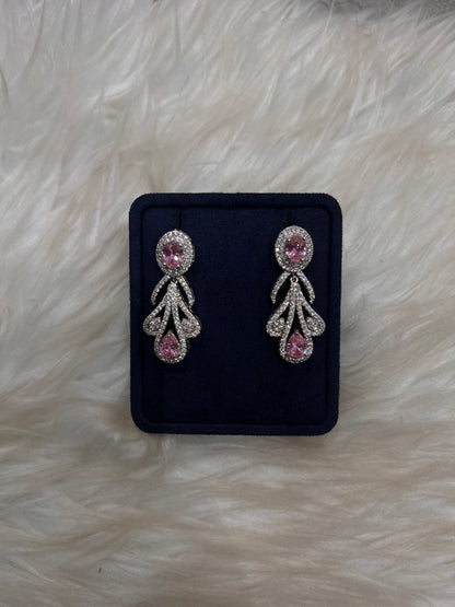 Pair of silver earrings with pink gemstones, Perfect for bridal party coordination or high-end formal wear.