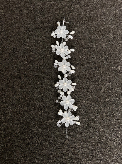 Perfect for the modern bride seeking romantic glamour, it features finished wire loops at each end to effortlessly pin into place for a comfortable, reliable fit throughout your celebration.