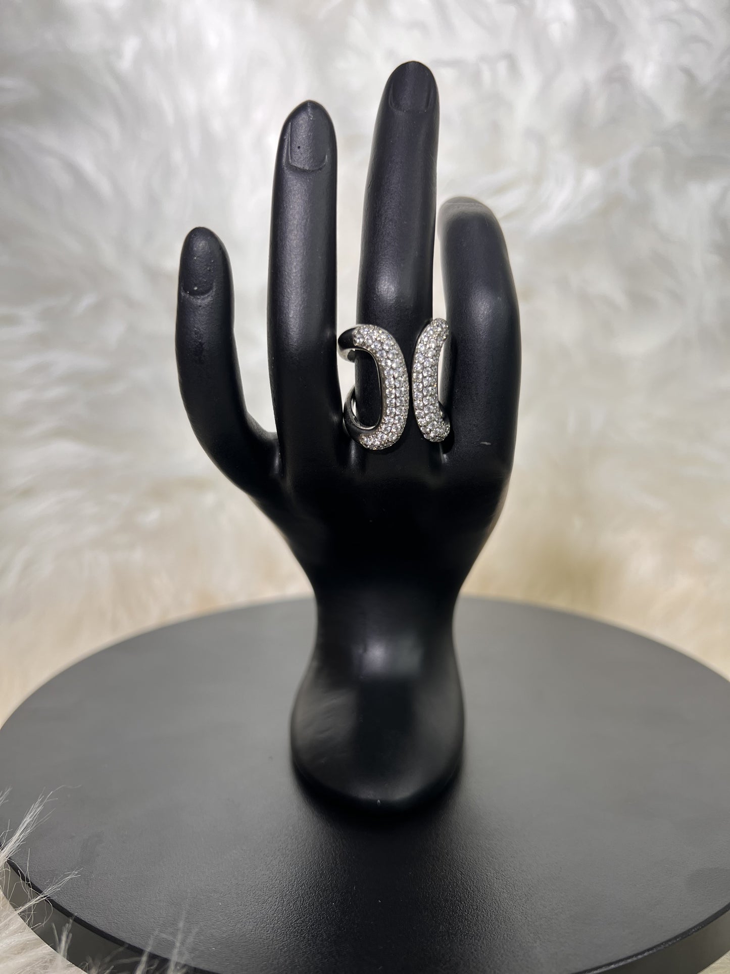 Whether worn as a chic bridal accessory or a standout piece for a gala, its contemporary design brings effortless sophistication to any ensemble.