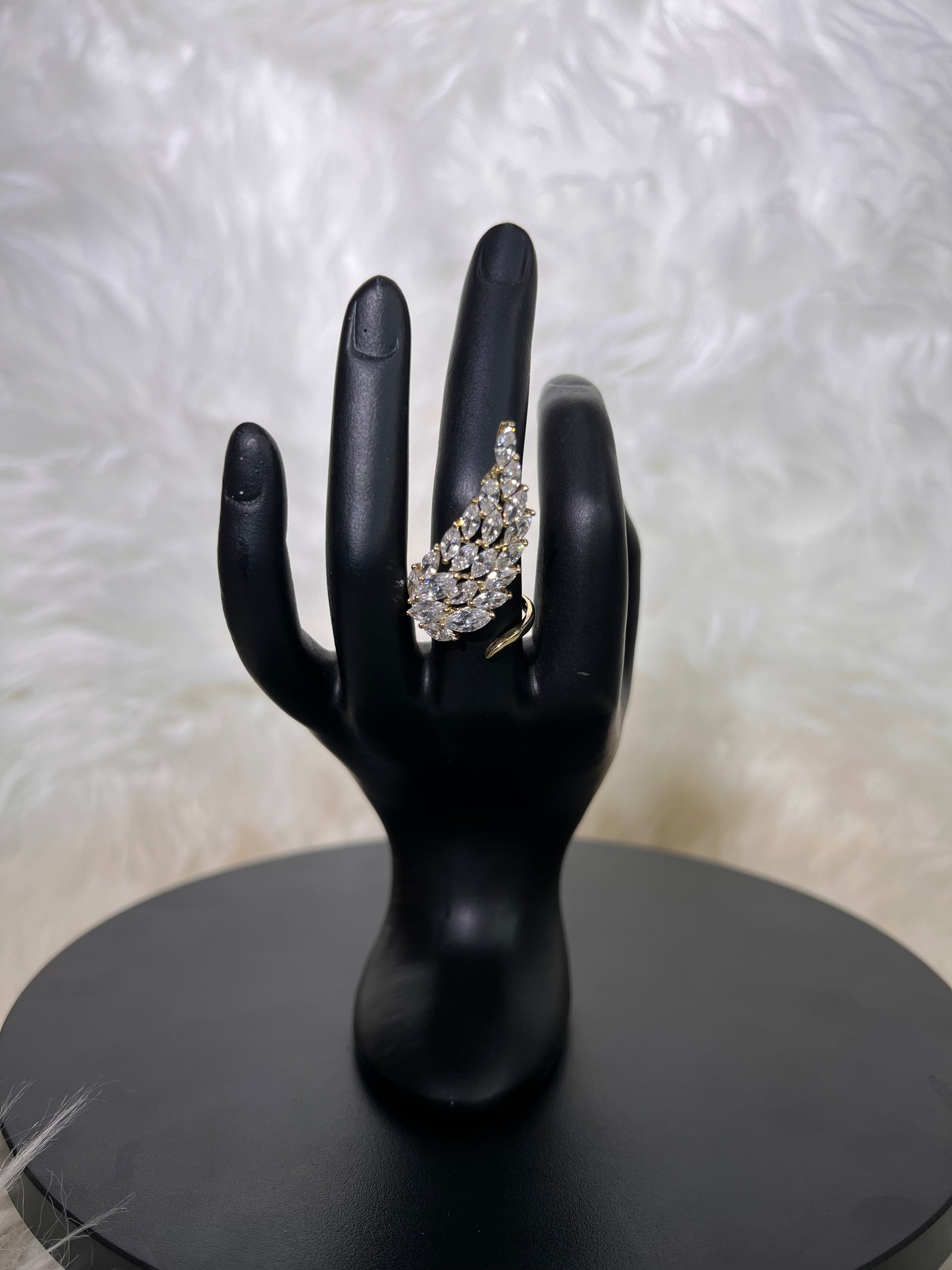 Make a fluid, high-fashion statement with our dramatic Marquise Wing Cocktail Rings. 