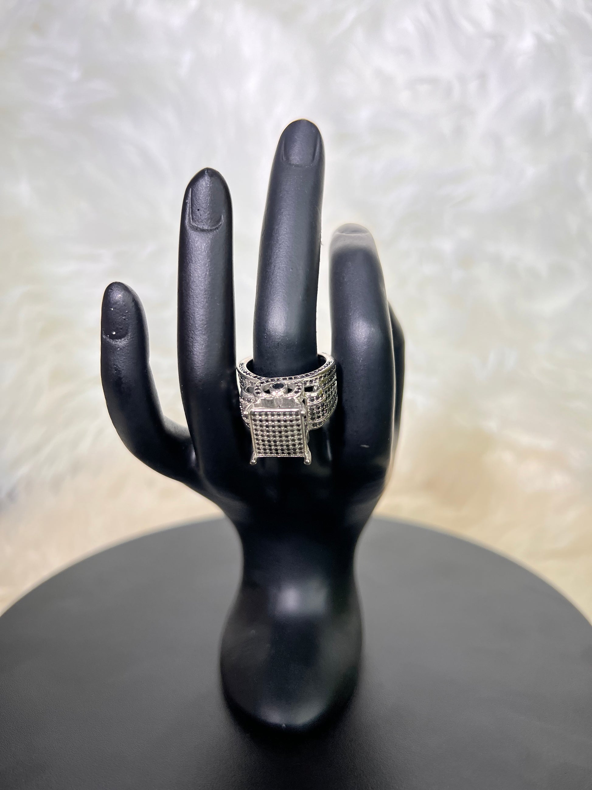 A powerful, architectural square signet design completely encrusted with ultra-sleek midnight black micro-pave stones. Set on a wide, detailed band, it offers a contemporary, high-fashion edge.