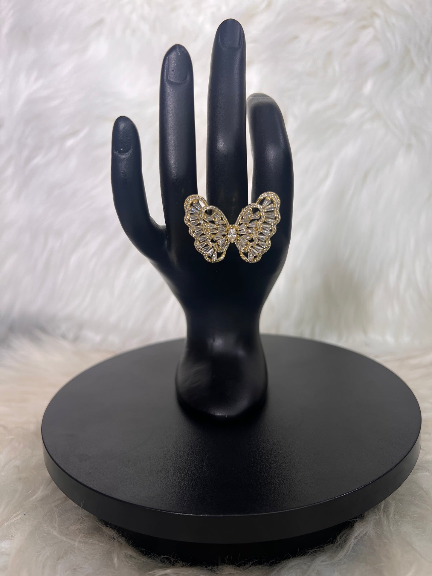 Features a full, detailed openwork wing pattern bordered by delicate micro-pave detailing.