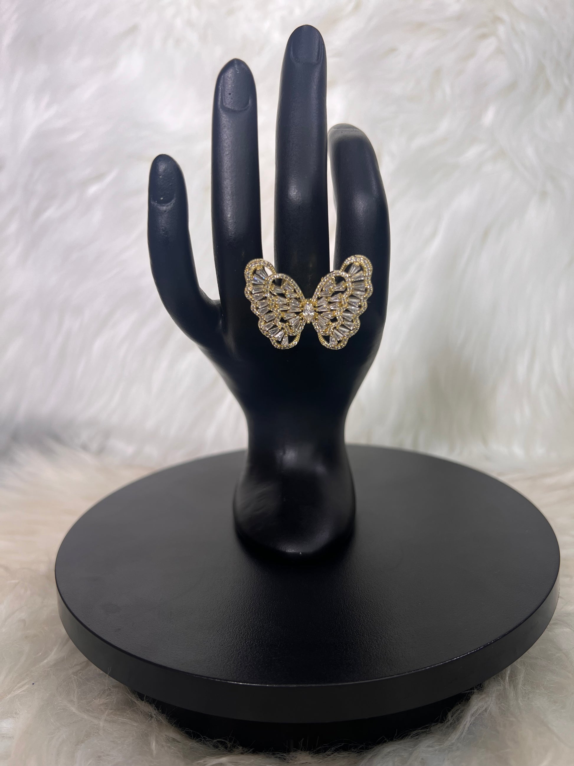 Features a full, detailed openwork wing pattern bordered by delicate micro-pave detailing.