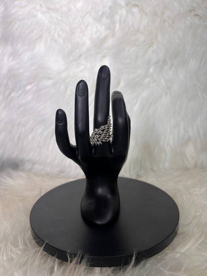 Whether you choose the crisp look of silver or the rich glow of gold, this piece brings effortless red-carpet drama to your ensemble.