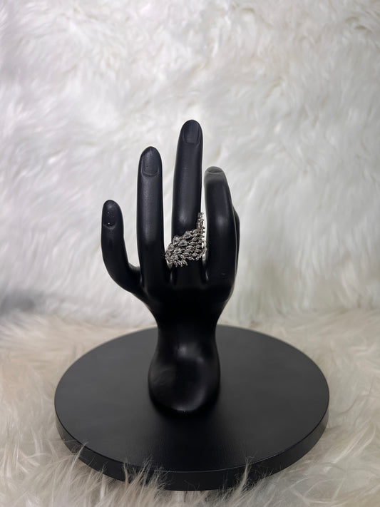 Whether you choose the crisp look of silver or the rich glow of gold, this piece brings effortless red-carpet drama to your ensemble.