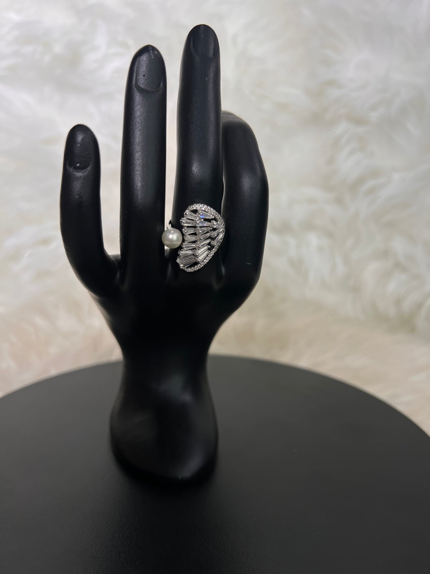  This captivating pairing of crisp structural crystals and soft organic pearls creates a high-fashion, museum-worthy access