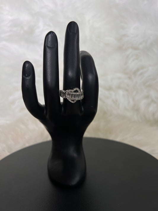 Set on a wide, stone-encrusted luxury band, this cocktail ring is a stunning statement of contemporary elegance.