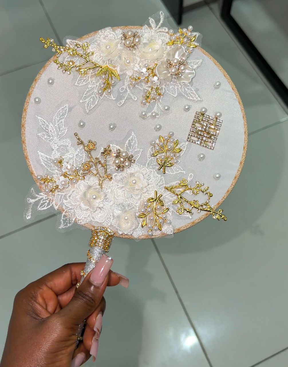Designed to complement bridal gowns and luxury evening wear, this hand fan is the ultimate accessory for high-fashion celebrations.